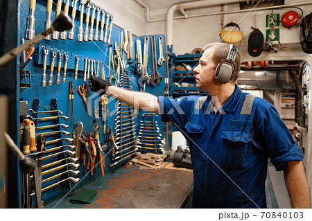Marine engineer officer in engine control room ECR 70840103