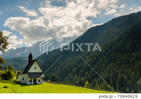 Beautiful view of church and famous dolomite mountain, Italy. Beautiful view of church and famous dolomite mountain, Italy. 70840629