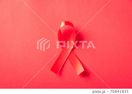 Red bow ribbon symbol HIV, AIDS cancer awareness 70841835