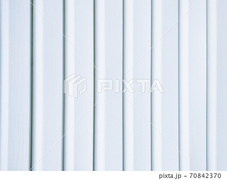 White vinyl wood siding panel background with imitation wood texture. 70842370