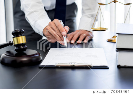 Lawyer or judge present client with contract document papers, Law and Legal services concept Lawyer or judge present client with contract document papers, Law and Legal services concept 70843464