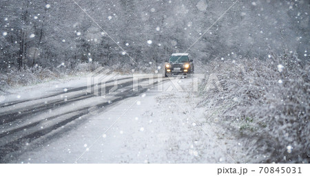 Car is driving on a winter road Car is driving on a winter road 70845031