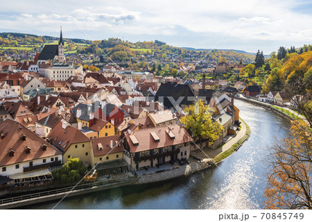 Aerial view of Vltava river, houses and medieval St. Vitus Church in Cesky Krumlov Aerial view of Vltava river, houses and medieval St. Vitus Church in Cesky Krumlov 70845749