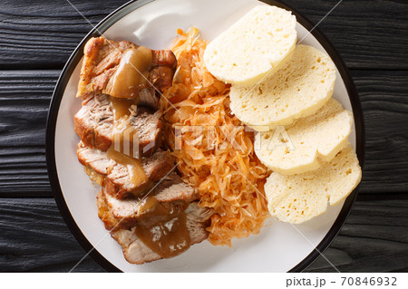 National Dish of Czech Republic Vepro Knedlo Zelo close-up in a plate. Horizontal top view National Dish of Czech Republic Vepro Knedlo Zelo close-up in a plate. Horizontal top view 70846932