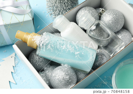 Box with winter cosmetics on blue background 70848158
