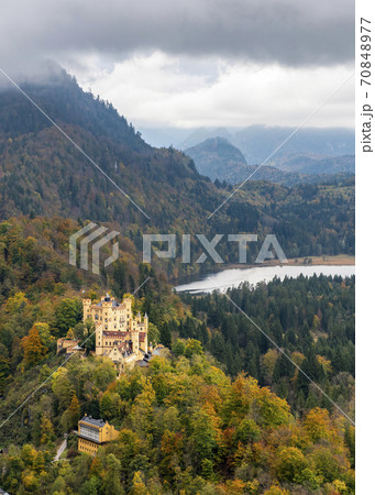 A view of Bavarian Alps, storm sky, lake and Hohenschwangau castle in Bavaria, Germany in autumn 70848977