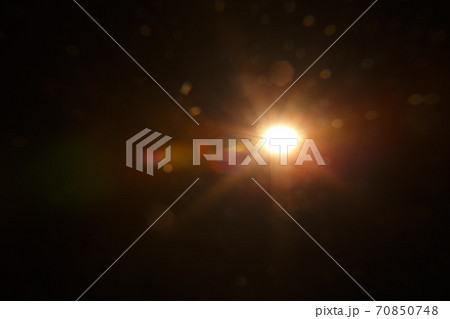 Abstract Natural Sun flare on the black background. Abstract Natural Sun flare on the black background. 70850748