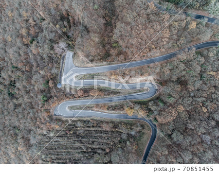 Seasons Concept winter or fall Aerial view Winding road serpentine mountain pass village Brodenbach Germany 70851455