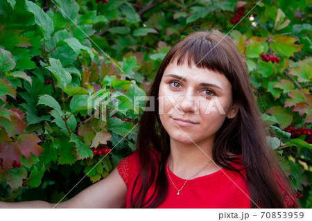 portrait of a young woman in red clothes portrait of a young woman in red clothes 70853959
