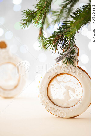 Gingerbread christmas ball on spruce branch. Copy space. Gingerbread christmas ball on spruce branch. Copy space. 70855831