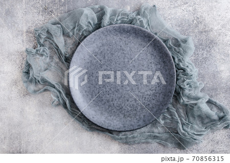 Empty bluish plate with gauze 70856315