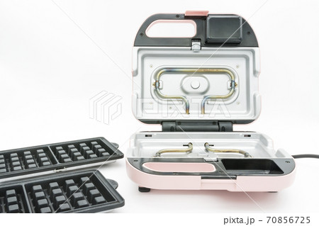 Modern waffle maker with removable plates isolated on the white background. Modern waffle maker with removable plates isolated on the white background. 70856725