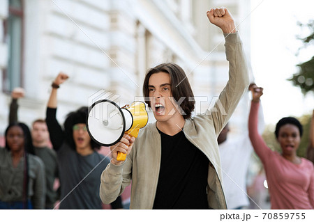Leader of strikers with loudspeaker yelling demands Leader of strikers with loudspeaker yelling demands 70859755
