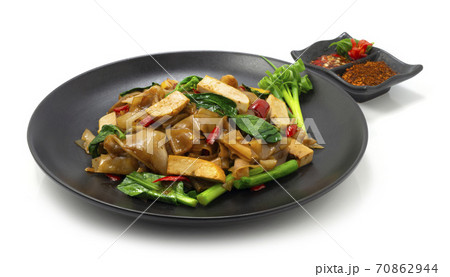 Spicy stir fried flat noodle with Tofu Vegetarian Chinese Style 70862944