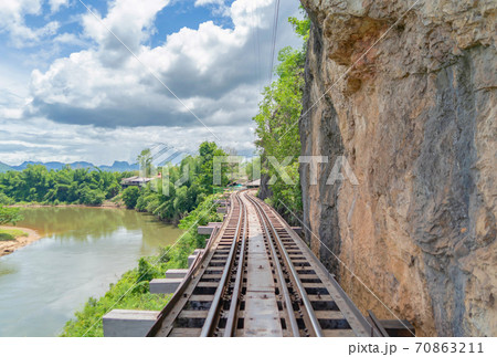 Empty train railway on River Kwai Bridge in Kanchanaburi town, Thailand in public transportation concept. Empty train railway on River Kwai Bridge in Kanchanaburi town, Thailand in public transportation concept. 70863211