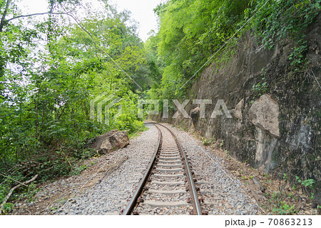 Empty train railway on River Kwai Bridge in Kanchanaburi town, Thailand in public transportation concept. Empty train railway on River Kwai Bridge in Kanchanaburi town, Thailand in public transportation concept. 70863213