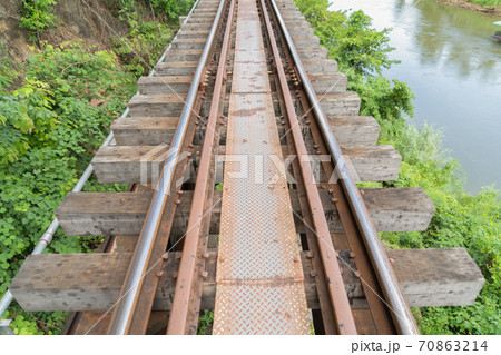 Empty train railway on River Kwai Bridge in Kanchanaburi town, Thailand in public transportation concept. Empty train railway on River Kwai Bridge in Kanchanaburi town, Thailand in public transportation concept. 70863214
