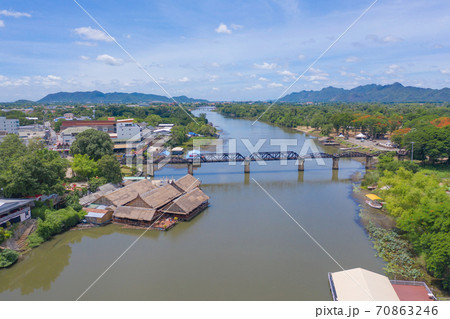 Aerial view of River Kwai Bridge with train rail way with Chao Phraya River, Tha Ma Kham, Mueang Kanchanaburi District, Thailand. Aerial view of River Kwai Bridge with train rail way with Chao Phraya River, Tha Ma Kham, Mueang Kanchanaburi District, Thailand. 70863246
