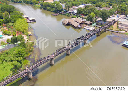 Aerial view of River Kwai Bridge with train rail way with Chao Phraya River, Tha Ma Kham, Mueang Kanchanaburi District, Thailand. 70863249
