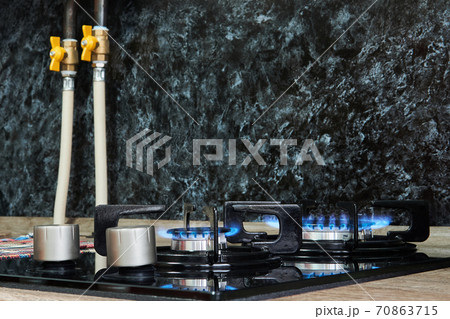 household cooktop with gas burners on 70863715