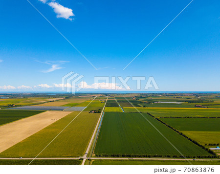 Aerial photo of cultivated fields near seaside resort Caorle at the Venetian Riviera in Italy 70863876