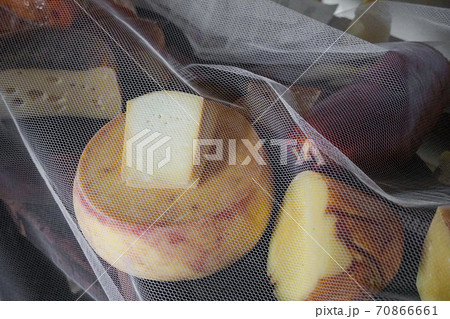 Variety of traditional cheese in a cheese farm store 70866661
