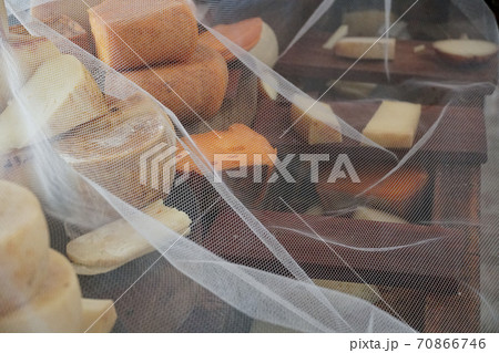 Variety of traditional cheese in a cheese farm store Variety of traditional cheese in a cheese farm store 70866746