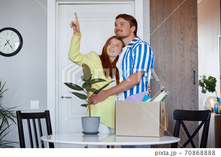portrait of happy new home owners discussing 70868888