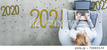 2021 with man using a laptop 70869144