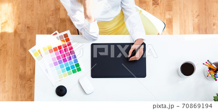 Graphic designer using her graphic tablet 70869194