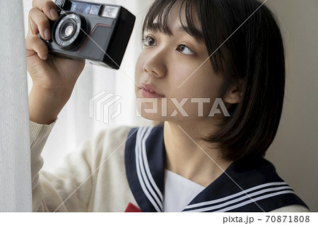 カメラと女子高生の写真素材