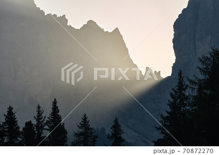 Sunrise between mountain cliffs Sunrise between mountain cliffs 70872270