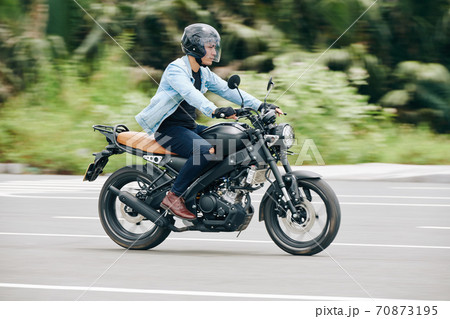 Riding fast on highway 70873195