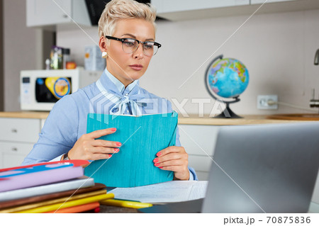 caucasian female young school teacher using webcam at home caucasian female young school teacher using webcam at home 70875836