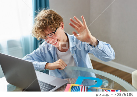 cute schoolboy say hello at camera cute schoolboy say hello at camera 70876186