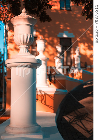 Porch with white stone columns Porch with white stone columns 70876511