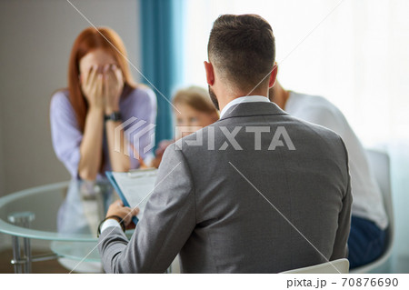couple turned to a lawyer to sign a divorce agreement couple turned to a lawyer to sign a divorce agreement 70876690