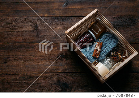 Care box, package ideas. Fall or Winter care box with sweets and warm clothes. Care Package Delivery, Fall Winter holidays Food Care gift box 70878437