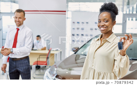 portrait of happy woman with car keys in hands portrait of happy woman with car keys in hands 70879342