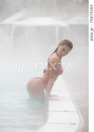 Sexy woman in hot pool 70879364