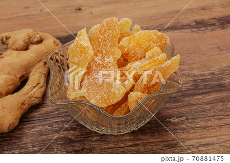 Dry sweet ginger in the bowl 70881475
