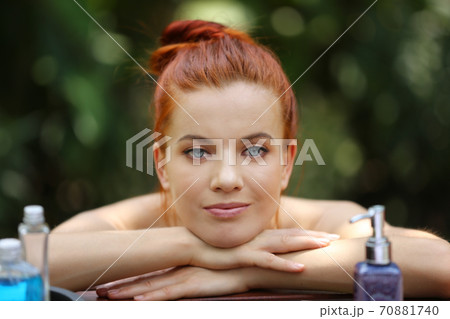 portrait of a woman lying on spa bed.	 70881740