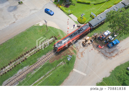 Aerial view of Thai local old classic train on railway on River Kwai Bridge in Kanchanaburi town, Thailand in public transportation concept. 70881838