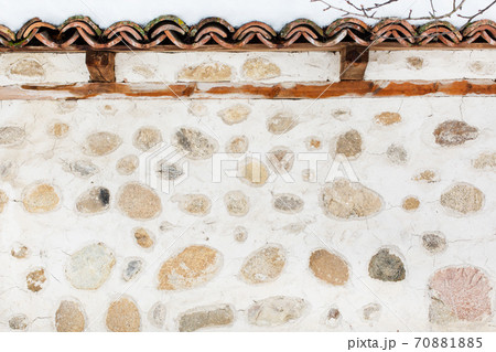 Background with traditional stone house wall 70881885