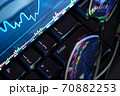 Stock market chart screen on keyboard computer and eyeglasses, online investment concept 70882253