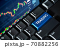 Stock market chart screen on keyboard computer and blue trading button, online investment concept 70882256