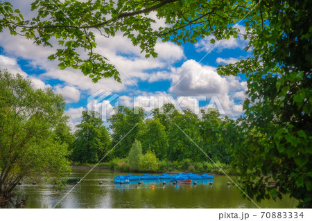 Empty blue paddle boats in London Park Empty blue paddle boats in London Park 70883334