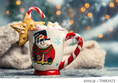 Warm marshmallow dessert beverage on Christmas decorated table Warm marshmallow dessert beverage on Christmas decorated table 70883423
