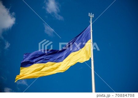 Ukrainian flag in the wind. Against the background of the sky Ukrainian flag in the wind. Against the background of the sky 70884708