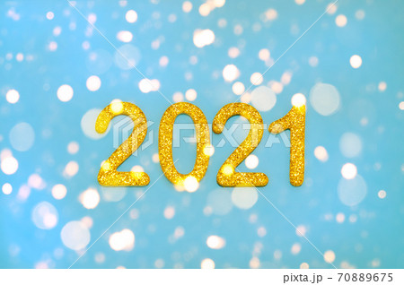 Glitter golden numbers 2021 on blue background. Happy new year 2021 celebration, glitter numbers on blue background. Glitter golden numbers 2021 on blue background. Happy new year 2021 celebration, glitter numbers on blue background. 70889675